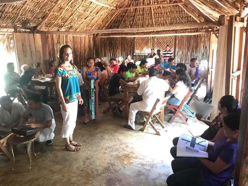 Geraldine Patrick opening a calendar workshop with participants in Xocén